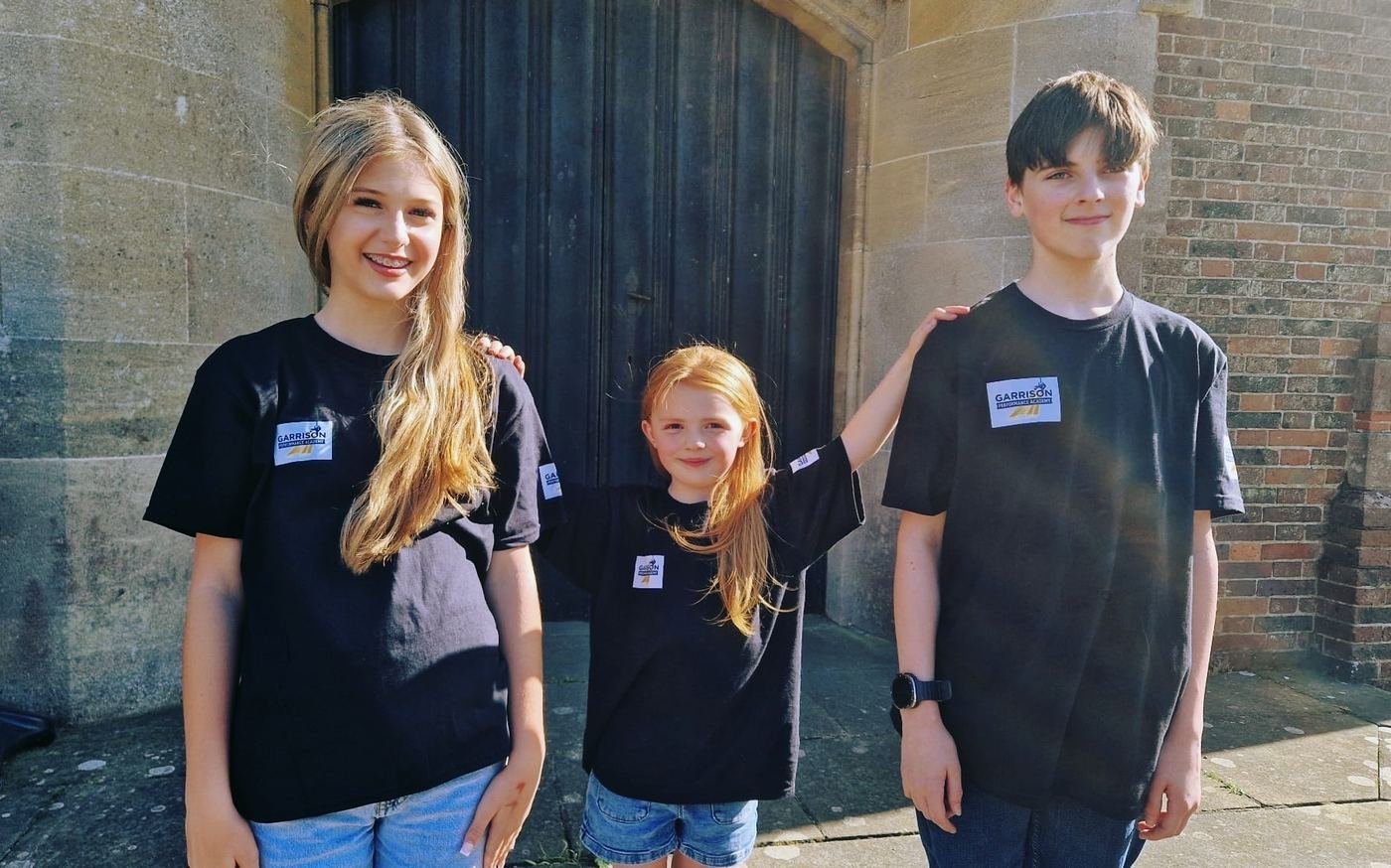Students standing together outside the theatre